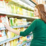 Shoppers choosing products from shelves